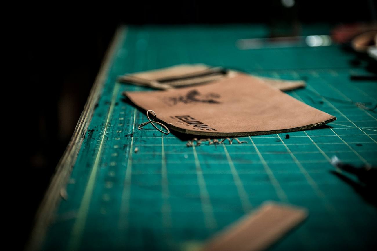 Leathercraft materials photographed in a workshop setting