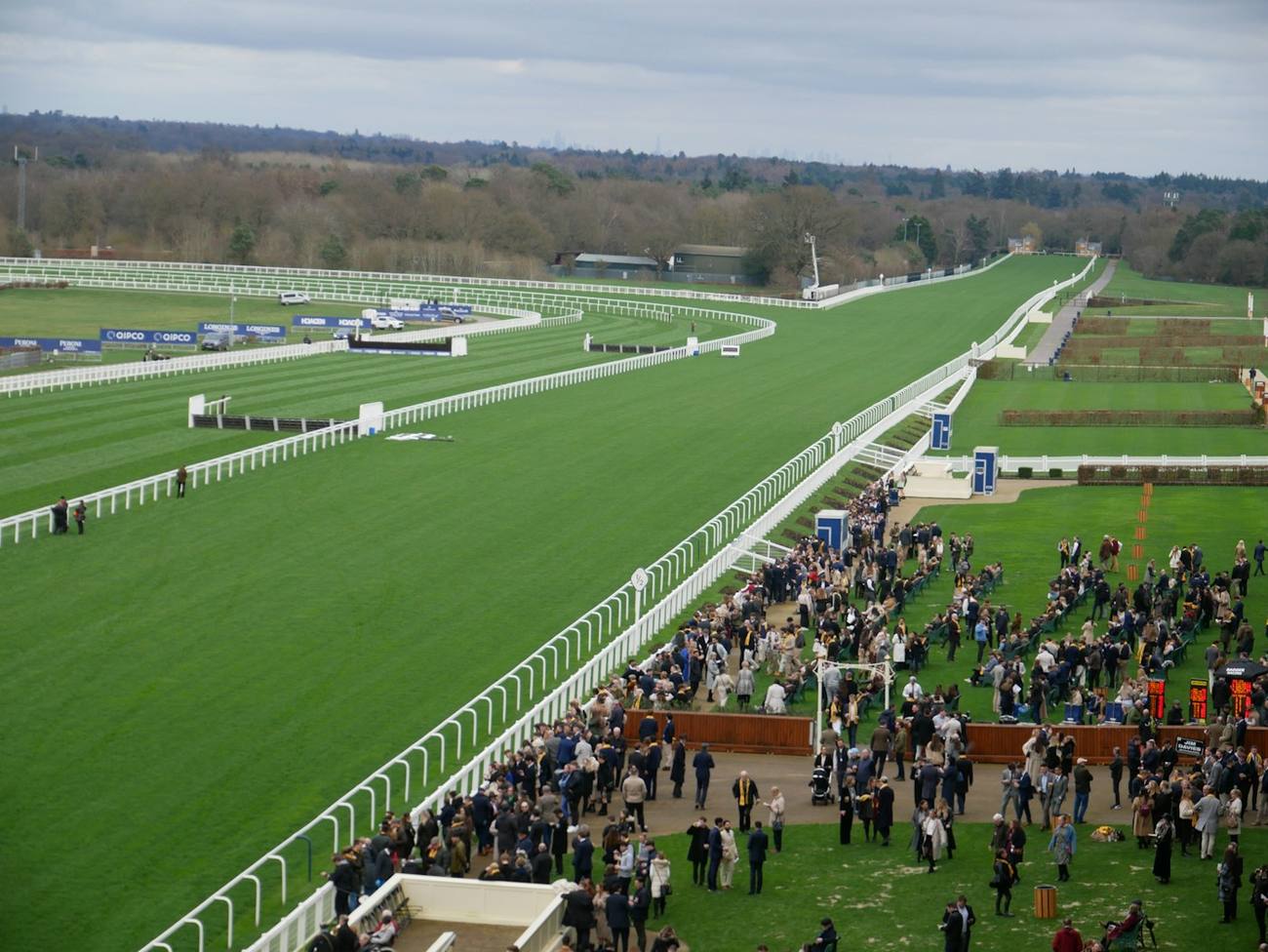 A racecourse and its spectators viewed from a grandstand